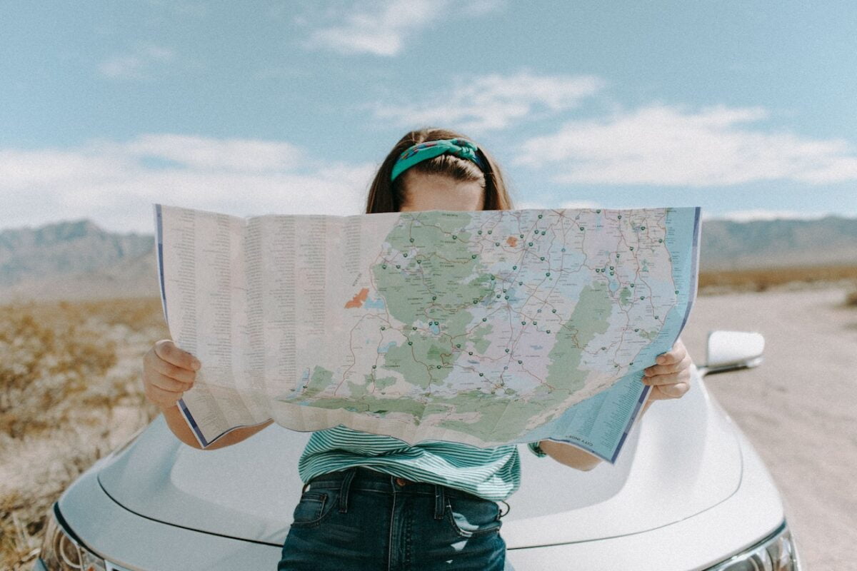 Woman looking at map in southern California