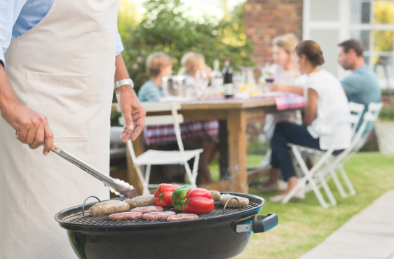 family gathering in backyard grilling confident there is life insurance protection