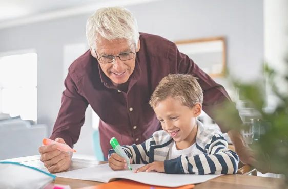 grandfather and grandson doing art grateful they have final expense insurance