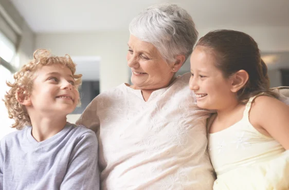 grandmother and two grandchildren spending time together secure knowing she has final expense insurance
