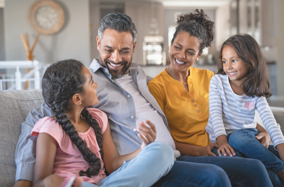 Happy family spending time together, financially protected from unexpected medical expenses with the right health insurance plan.
